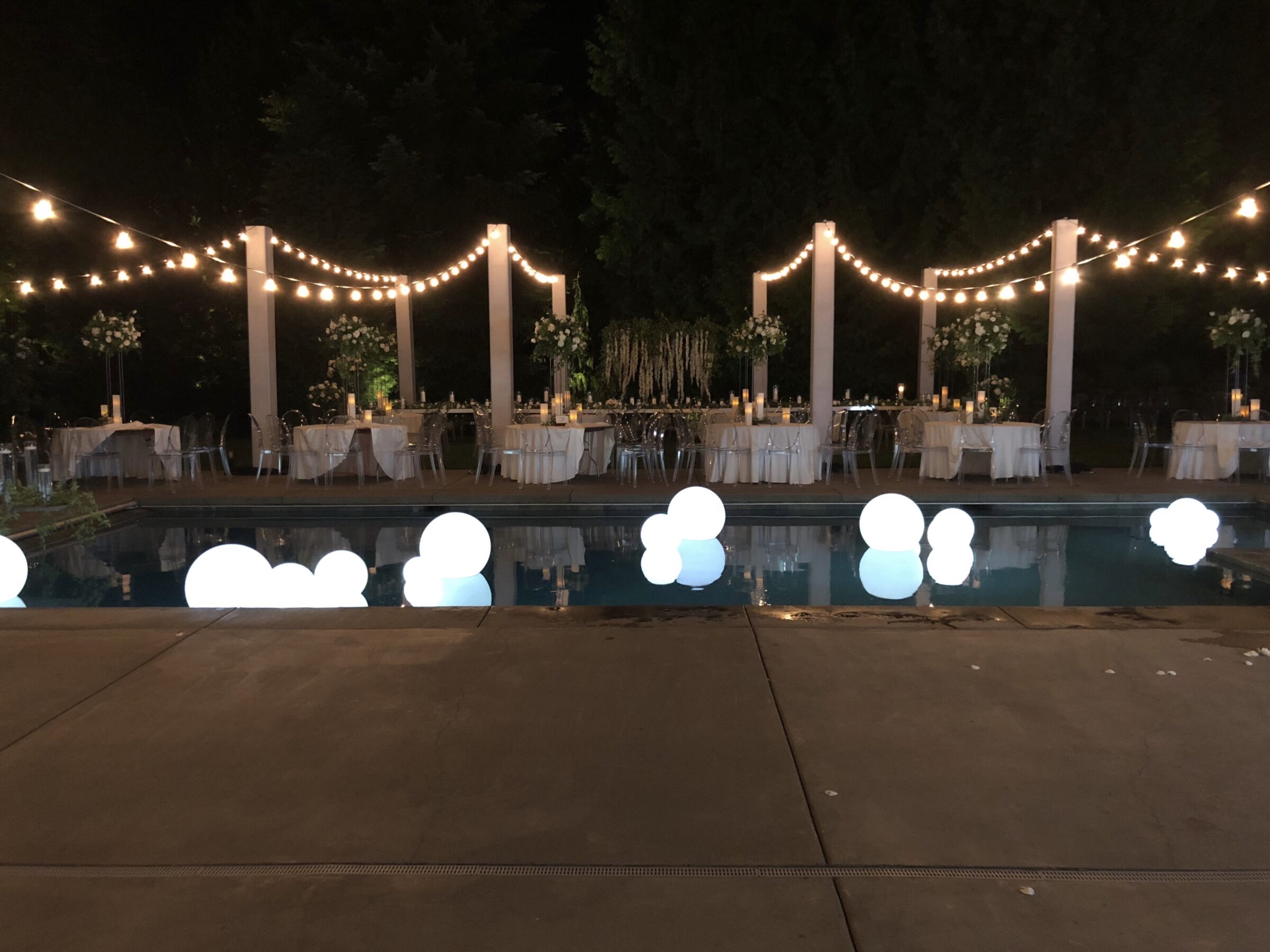 glowing orb fixtures floating in a swimming pool or water